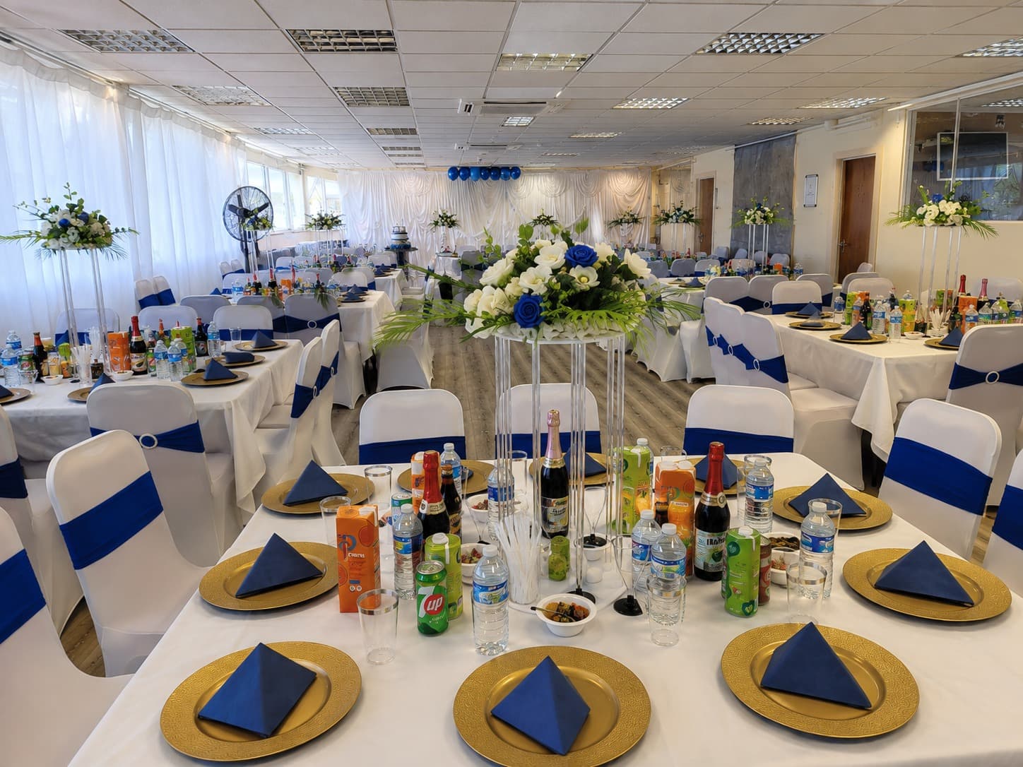 Praise Auditorium arranged with decorated tables for a celebration