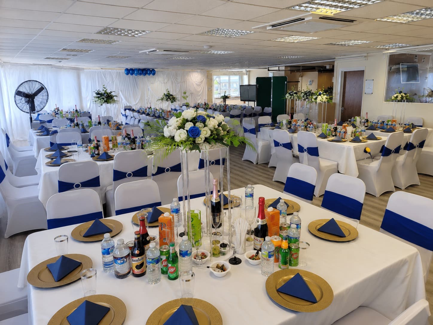 Wide view across a banquet setup at Praise Auditorium