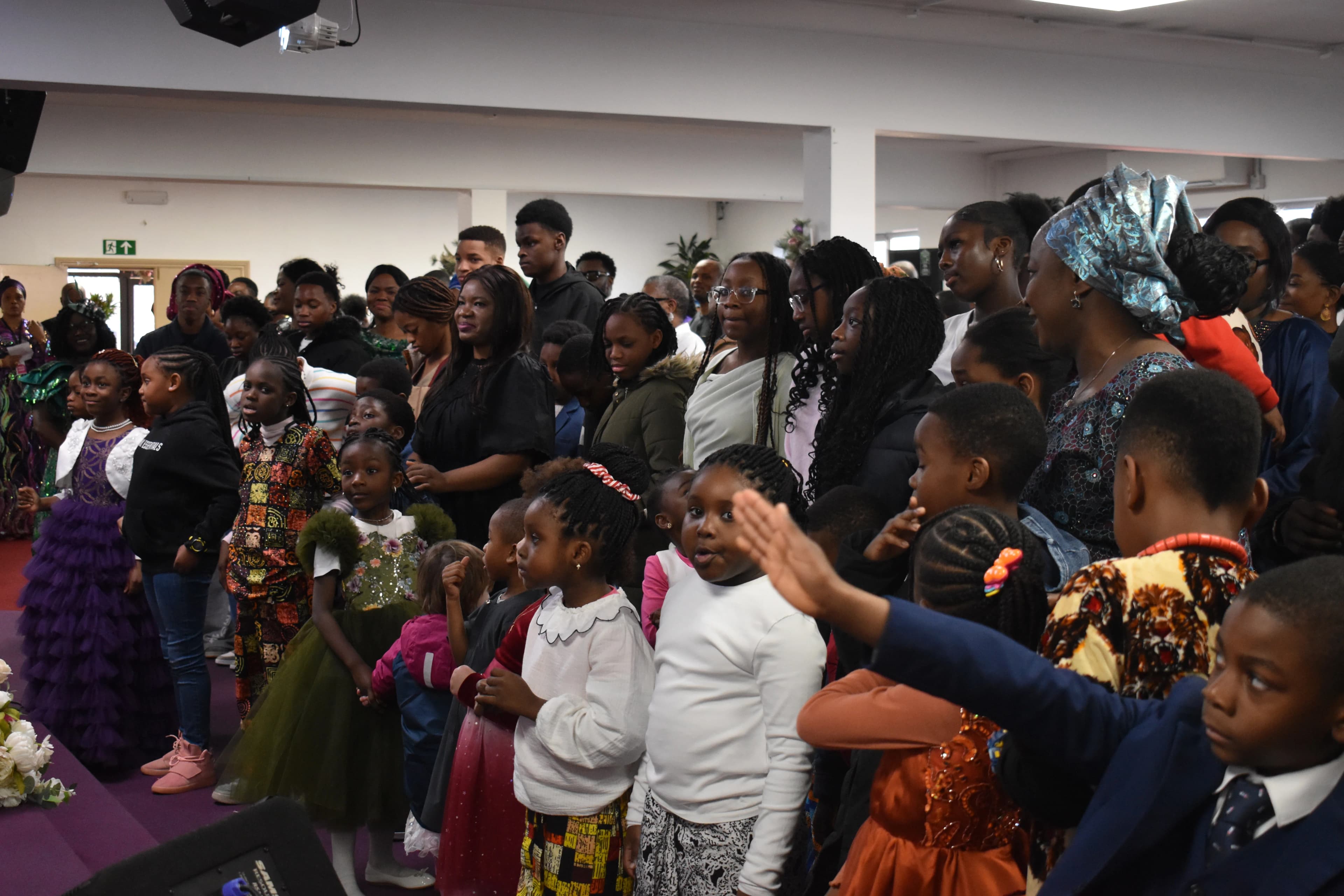 Worship and fellowship during a service at Praise Tabernacle.